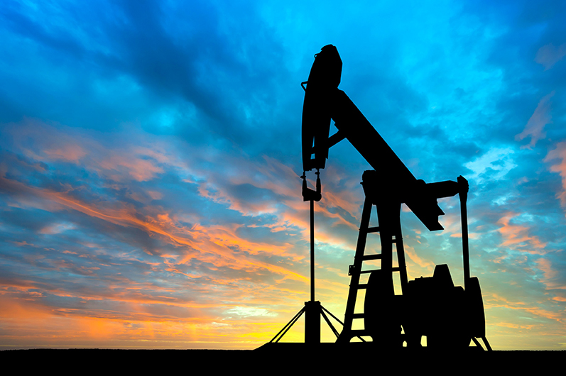Dawn over petroleum pump industrial real estate oil and gas