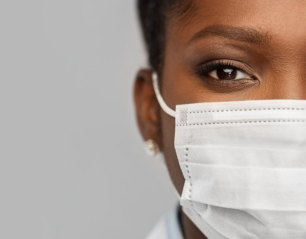 african american female doctor in facial mask health care