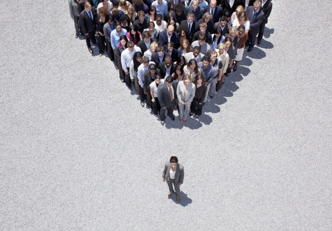 Businesswoman at apex of crowd leadership jon gordon